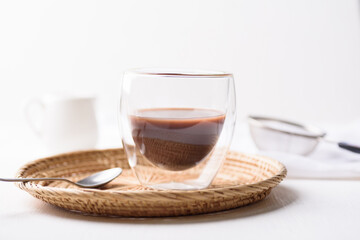 Hot chocolate in a glass on a white background