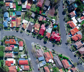 Panoramic Aerial Drone view of Suburban Sydney housing, roof tops, the streets and the parks NSW Australia