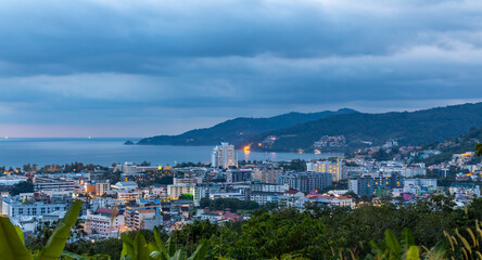 Fototapeta na wymiar night sunset view of Patong and patong beach with the buildings and high-rise hotels and resorts in the background Kathu phuket Thailand 