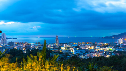 night sunset view of Patong and patong beach with the buildings and high-rise hotels and resorts in the background Kathu phuket Thailand 