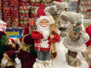 Santa Claus in red colorful clothes, christmas gifts. Merry Christmas concept, greetings on xmas eve.