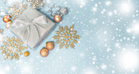 Silver gold Christmas gifts with snow background. silver decorations on pastel silver background. Flat lay, top view, Presents for Birthdays. Box with gifts tied with ribbon and bows. happy new year