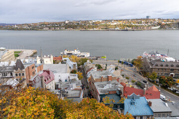 Quebec, Canada - October 19 2021 : Quebec City old town street view and Saint Lawrence River in autumn.