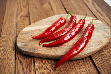 red hot chili peppers on a wooden board kitchen ingredients