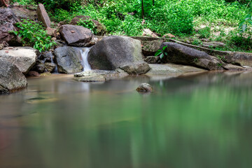 Kathu waterfall water gently flowing down the rocks Patong Phuket Thailand Asia