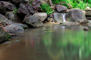 Fototapeta na wymiar Kathu waterfall water gently flowing down the rocks Patong Phuket Thailand Asia
