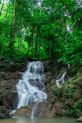 Kathu waterfall water gently flowing down the rocks Patong Phuket Thailand Asia