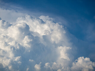 White cumulus clouds and blue sky. Stratosphere. Beautiful, dramatic clouds.