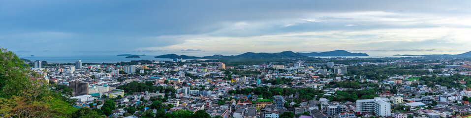 Panoramic view old phuket town viewed from Khaorang Hill and in the distance is Challong Bay and the islands big Buddha and Rawai Phuket Thailand