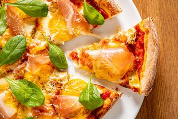 fresh pizza on the wooden background