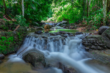 Kathu waterfall water gently flowing down the rocks Patong Phuket Thailand Asia