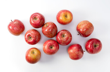 A lot of apples placed on a white background.