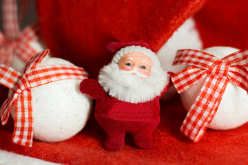 Obraz na płótnie Canvas Santa Claus toy and Christmas balls
