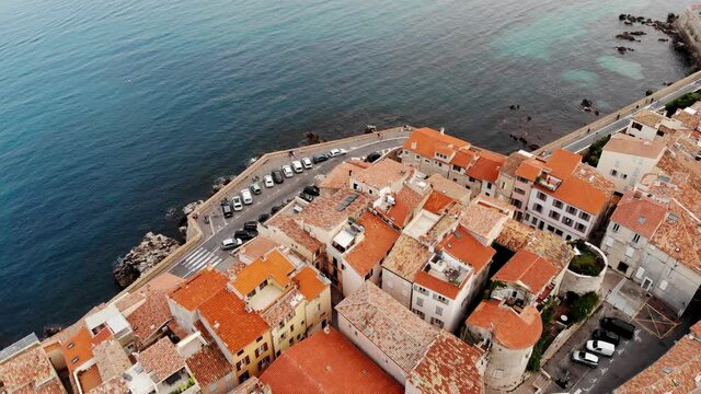 Drone shot of the old city of Antibes. Cote d'Azur of the Mediterranean Sea of ​​France. Resort on the French Riviera Antibes. Picasso Museum. View from the drone yachts moored in the city marina.