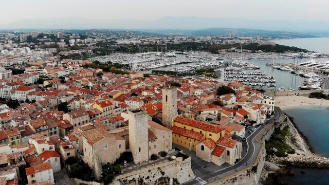 Drone shot of the old city of Antibes. Cote d'Azur of the Mediterranean Sea of ​​France. Resort on the French Riviera Antibes. Picasso Museum. View from the drone yachts moored in the city marina.
