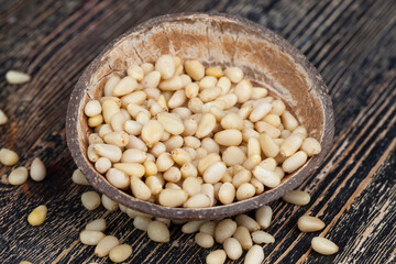 dried cedar nuts on a wooden table