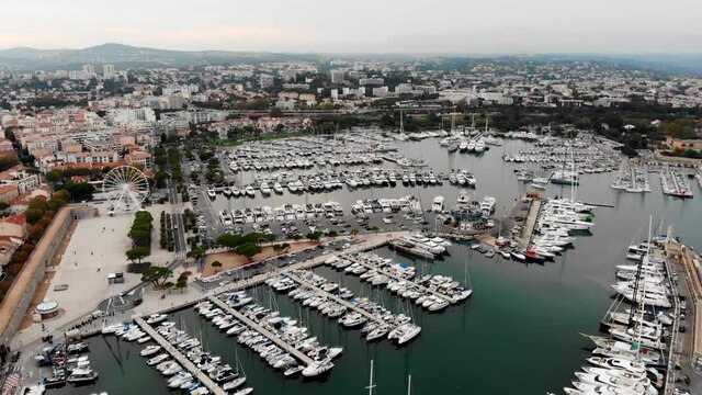 Drone shot of the old city of Antibes. Cote d'Azur of the Mediterranean Sea of ​​France. Resort on the French Riviera Antibes.
View from the drone yachts moored in the city marina.
