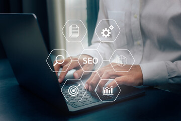 Closeup businessman working with laptop, SEO search engine optimization concept diagram with icon.