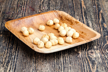 dried hazelnutsnuts on a wooden table