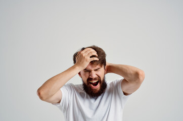 emotional man holding his head pain stress emotions Studio treatment
