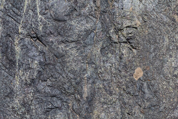 Stone texture. Closeup of the rough texture of a big rock. Surface of the stone for natural background. Closeup blurred stone background texture. a rock