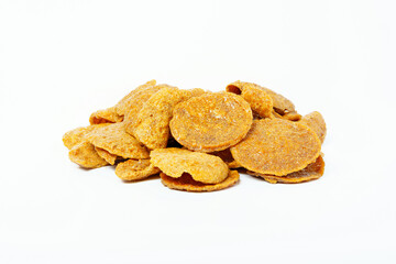 Thai crispy fish snack isolated on white background. Close up of crispy fish pile.