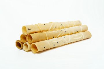 Thai crispy dessert roll isolated on white background. Close up of Tong Muan or Thai wafer.