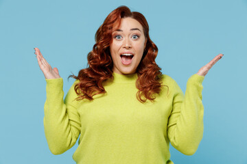Young surprised amazed shocked chubby overweight plus size big fat fit woman wear green sweater...