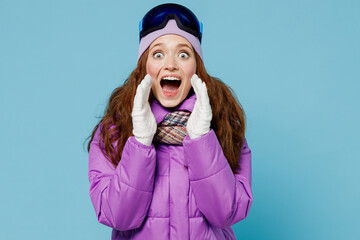 Skier woman in warm purple padded windbreaker jacket ski goggles mask spend extreme weekend in...