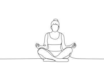 woman in sports top and leggings sits in lotus position with bun of hair on her head - one line drawing vector. alone exercise concept, meditation process