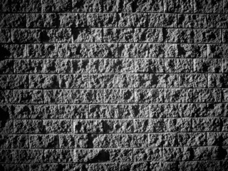 granite stone wall background texture black white old stone siding with different sized stones dark