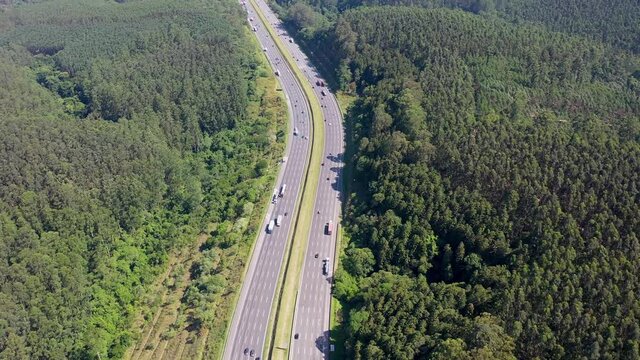 Aerial landscape of Bandeirantes highway road at countryside of Sao Paulo state Brazil. Landmark highway road between mountains. Rural landscape. Traffic at road. Brazilian freeway road.