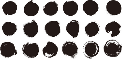 A set of black circles painted with a brush.