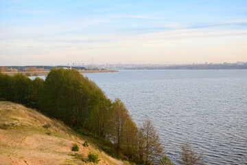 Fototapeta na wymiar View of Cheboksary city from the other bank of the Volga river in the evening