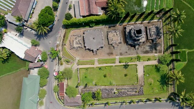 Top down aerial view on ancient Ngawen temple and rice field, Java, Indonesia