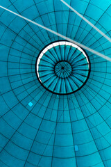 Naklejka premium Inside view of blue textile of balloon filled with hot air gas. Hot air release hat on the top of balloon