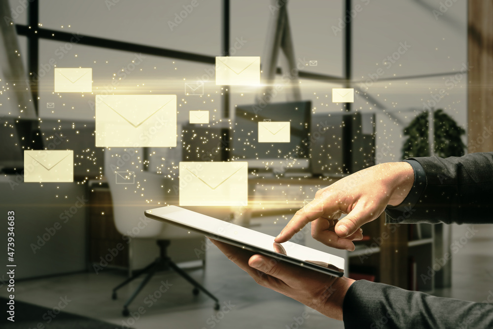 Poster Close up of businessman hand pointing at tablet with creative glowing letters interface on blurry office interior background. E-mail networking and correspondence concept.