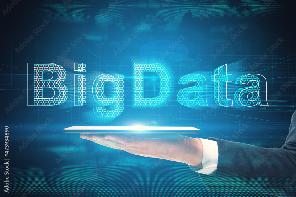 Poster close up of businessman hand holding tablet with creative glowing coding big data interface on blue 