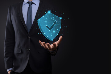 Businessman hold low poly polygon shield with a tick icon.Secure Access System Concept.Business...