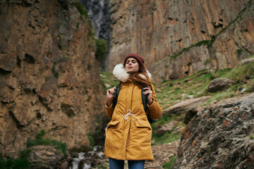 Fototapeta premium woman hiker with backpack mountains travel adventure freedom