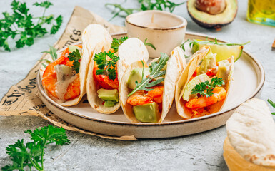 Diet healthy tacos with shrimps and avocado.