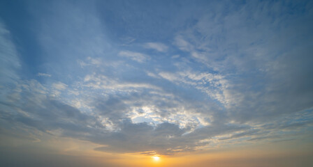 Sunset sky. Abstract nature background. Dramatic blue with orange colorful clouds in twilight time.