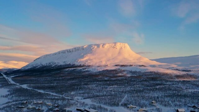 Aerial hyperlapse view around the Saana mountain, sunrise in Lapland - orbit, drone shot