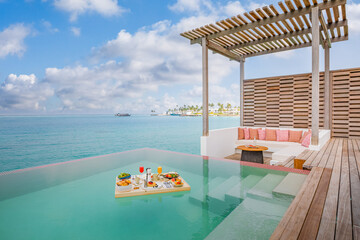 Breakfast in swimming pool floating. Luxury summer vacation or honeymoon destination. Resort hotel...