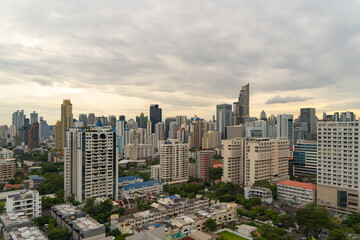 Fototapeta premium Aerial view of Bangkok Downtown Skyline, Thailand. Financial district and business centers in smart urban city in Asia. Skyscraper and high-rise buildings at sunset.