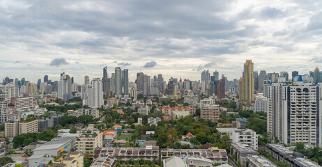Fototapeta premium Aerial view of Bangkok Downtown Skyline, Thailand. Financial district and business centers in smart urban city in Asia. Skyscraper and high-rise buildings at sunset.