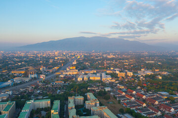 Aerial view of Chiang Mai Downtown Skyline, Thailand. Financial district and business centers in smart urban city in Asia. Skyscraper and high-rise buildings at sunset.