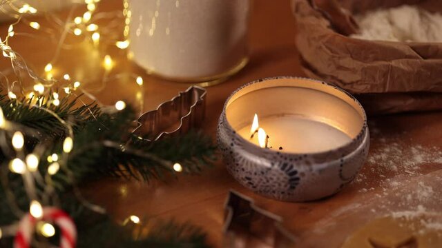 Candle light on Christmas. Preparing for baking gingerbread. Christmas mood