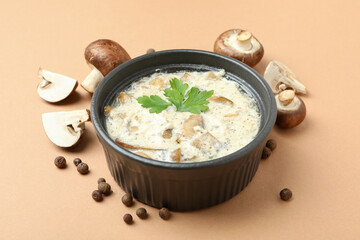 Concept of tasty food with mushroom sauce on beige background