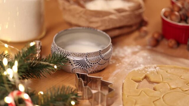 Candle on Christmas. End of baking gingerbread. Christmas mood. Put out the candle. 4K, 50fps